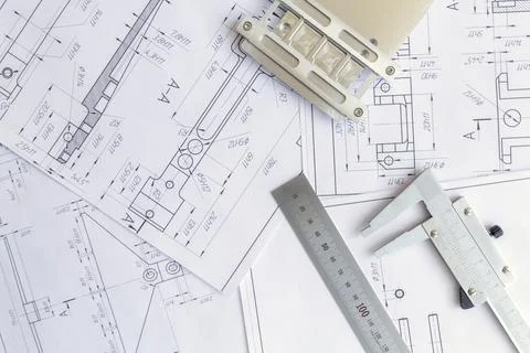 Top view of a caliper measuring tool, ruler and detail drawings.Engineering d Stock Photos