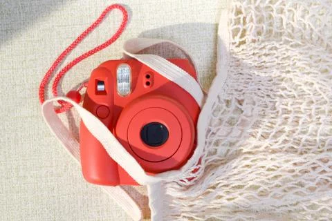 Top view of camera and wicker bag Stock Photos