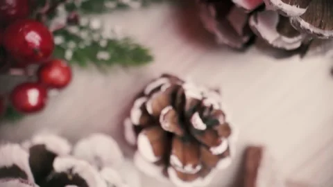 Top-view camera moves upward across Christmas table decorations, revealing .. Stock Footage 321287879