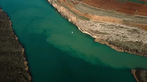 Top view of the canyon and river. A boat sailing on the river. Waterway. Stock Footage 236891825