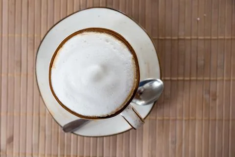 Top of view cappuccino coffee on table, focus at white foam.white cup of Hot Stock Photos