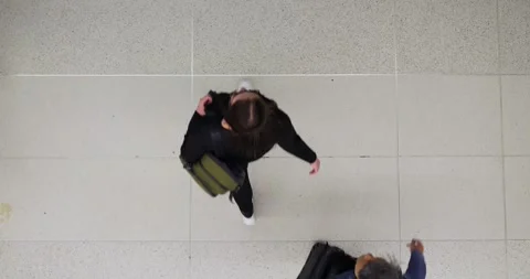 Top view captures crowd navigating busy streets, epitomizing life in city. Swift Stock Footage 254693823