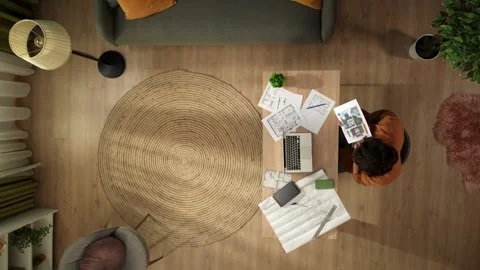 Top view capturing a man working in his home office, getting a videocall. Young Stock Footage 260054056