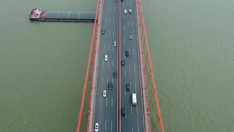Top View of a Car Traffic on the Huge Red Suspension Bridge Stock Footage 243827450