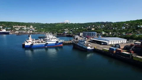 Top view of cargo ship with containers at the pier. City on the background Stock Footage 84955932