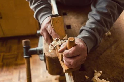 Top view of carpenter hand working with wood planer Stock Photos