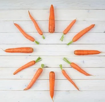 Top view of carrots in the shape of a clock for posters and healthy food menu Stock Photos