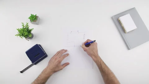 Top view, caucasian man draw, sketch an object to be crafted Stock Footage 138064109