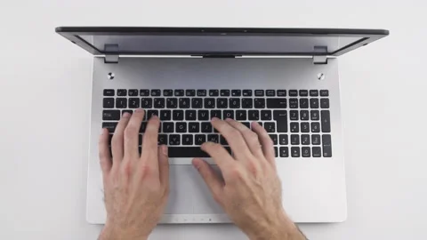 Top view, caucasian man is typing, using keyboard on laptop with his hand  Stock Footage 138036327