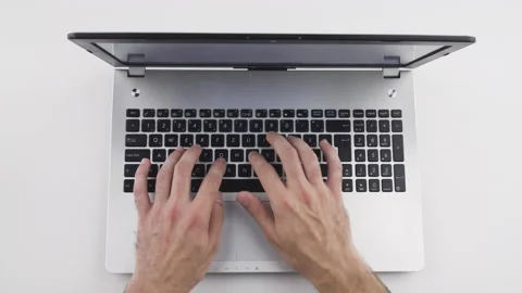 Top view, caucasian man is typing, using keyboard on laptop with his hand  Stock Footage 138036779