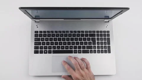 Top view, caucasian man using touchpad, trackpad on laptop with his hand  Stock Footage 138035171