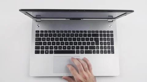 Top view, caucasian man using touchpad, trackpad on laptop with his hand Stock Footage 138035512