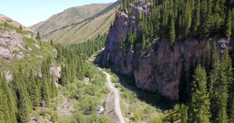 Top view of the cave, forest, rocks and road. Video stock 139746380