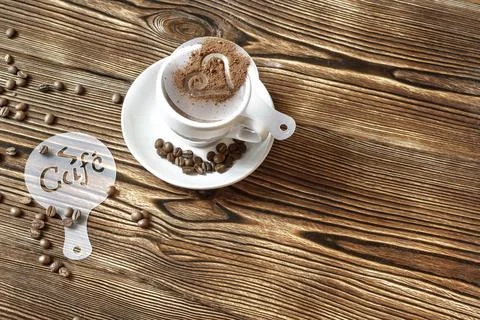 Top view of ceramic cup of hot cappuccino coffee latte with drawing picture.. Stock Photos