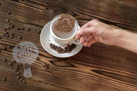 Top view of ceramic cup of hot cappuccino coffee latte with drawing picture.. Stock Photos