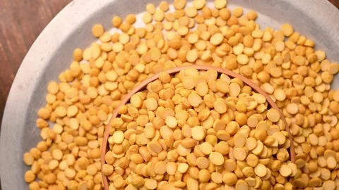 Top View of Chana Dal (Split Chickpeas - Bengal Gram) in Bowl Stock Footage 329340468