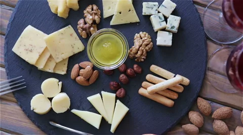 Top view cheese plate Assortment of various types of cheese Video stock 62982273