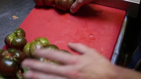Top view of chef cleaning tomatoes Stock Footage 137945816