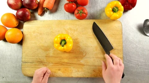 Top view chef cleans bulgarian pepper Stock Footage 76091120