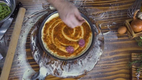 Top view chef cook making pizza with sausage pepperoni in pizzeria kitchen Stock Footage 99032655