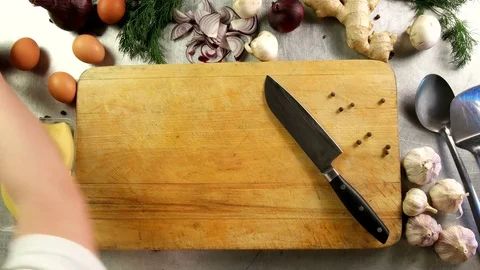 Top view chef cuts an apple into half-rings on a cutting board Stock Footage 76120289