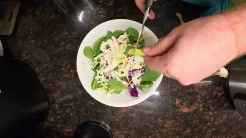 Top view of chef cutting spring onion for preparing coleslaw. Close up. Video stock 321497527