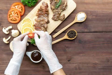 Top view chef decorating steak Stock Photos