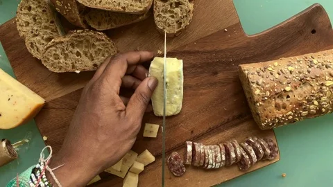 Top view chef preparing wooden board with appetizers - 15 s Stock Footage 127942897