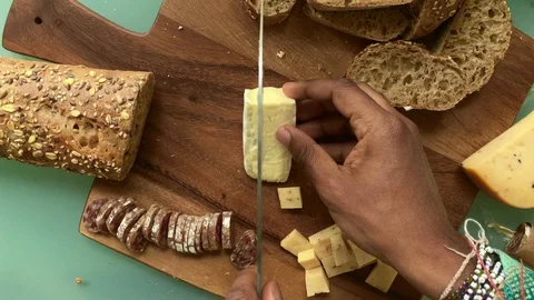 Top view chef preparing wooden board with appetizers- 25sec Stock Footage 128015971