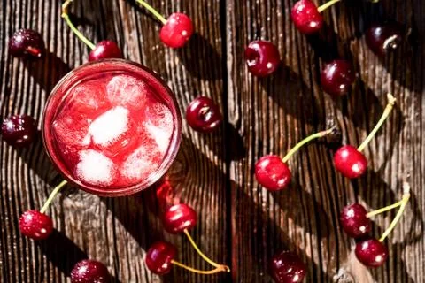 Top view cherries and cherry fruit drink on wood 写真素材