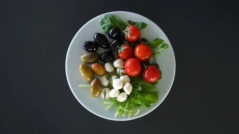 Top view, cherry tomatoes, black and green olives and mozzarella cheese balls 動画素材 119221526