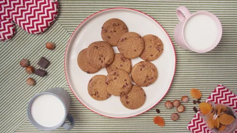 Top view child hand take fresh cookies from plate. Homemade cookies for family Stock Footage 138090044
