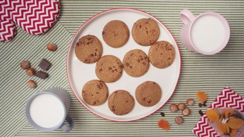 Top view child hands take fresh cookies from plate. Homemade cookies for family Stock Footage 138098938