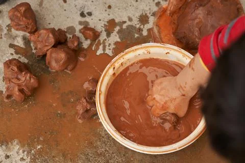 Top view as a child modeling clay balls. Stock Photos