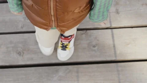 Top view of child sneakers on pier Stock-Footage 320137769