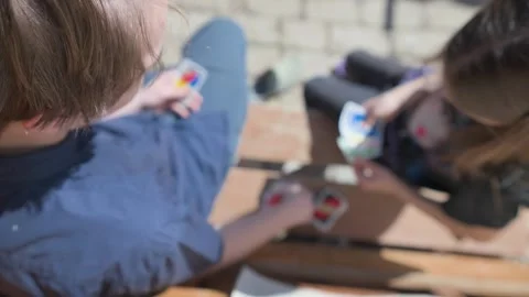 Top view of a Children Playing Card Game Outdoors Stock Footage 308863997