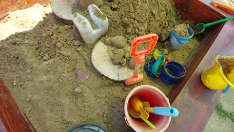 Top view of children Sandbox filled with sand bucket plastic shovels and toys Stockbeeldmateriaal 346245741