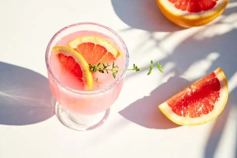 Top view of chilled summer drinks with grapefruit or red orange on a wooden tray Stock Photos