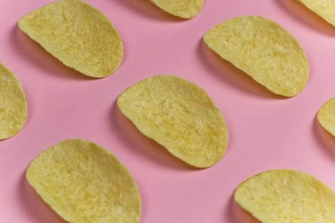 Top view chips pattern pink pastel background Stock Photos