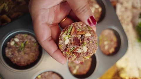 Top view of Chocolate Delight  covered with Dark Chocolate dry fruits and dates. Stock Footage 282766724