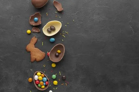 Top view chocolate easter egg with candy bunny shaped cookie Stock Photos