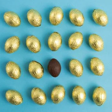 Top view of Chocolate Easter eggs on blue background Stock Photos