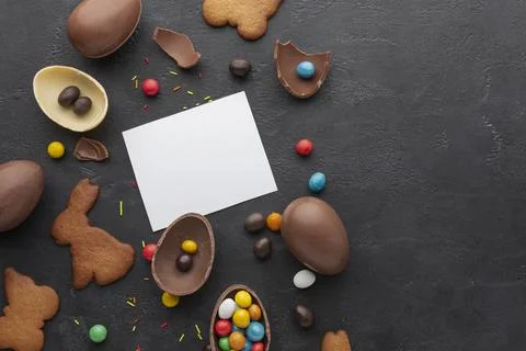 Top view chocolate easter eggs with colorful candy copy space Stock Photos