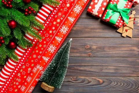 Top view of Christmas background made of fir tree, rolled wrapping paper an.. Stock Photos