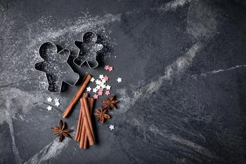 Top view of christmas baking ingredients on black marble background with copy Stock Photos