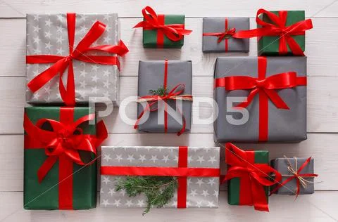 Top view of christmas present boxes on white wood background Stock Photos