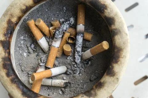 Top view cigarette after smoke in ashtray. Stock Photos