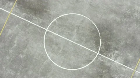 Top view of the circle in the middle of a basketball field and zooming out Stock Footage 146352232