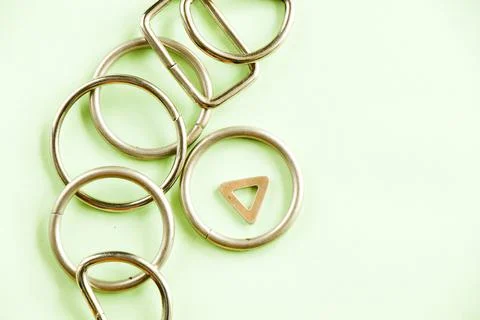 A top view of circle, rectangular, and triangle metal geometric figures on th 스톡 사진