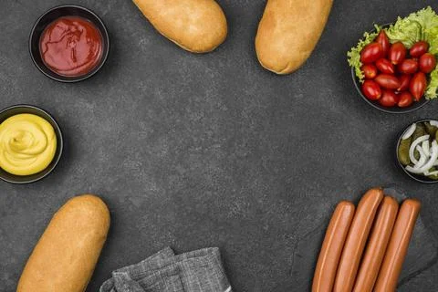 Top view circular frame with hot dog ingredients Stock Photos
